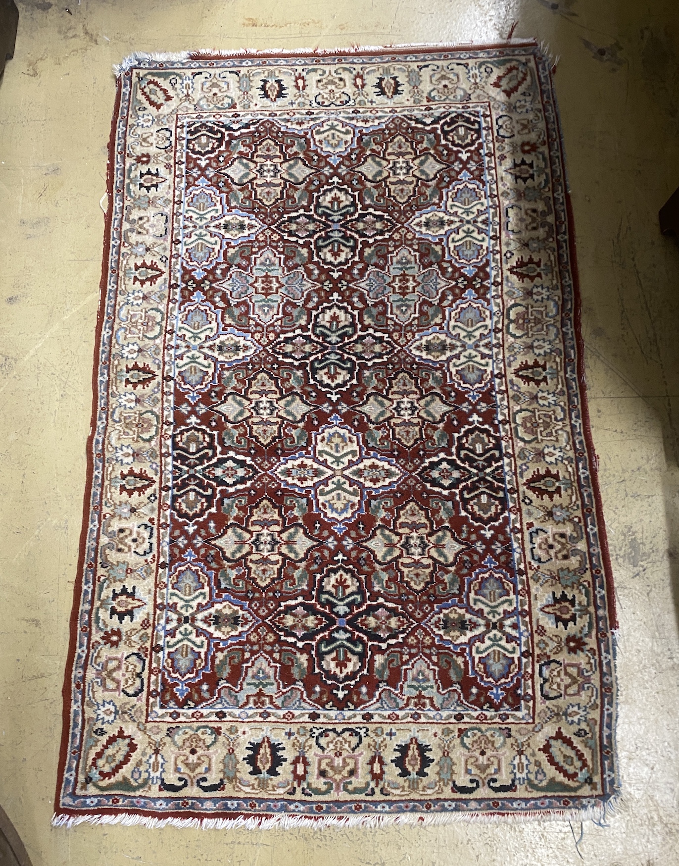 A North West Persian rug and a Bokhara rug, larger 114 x 84cm